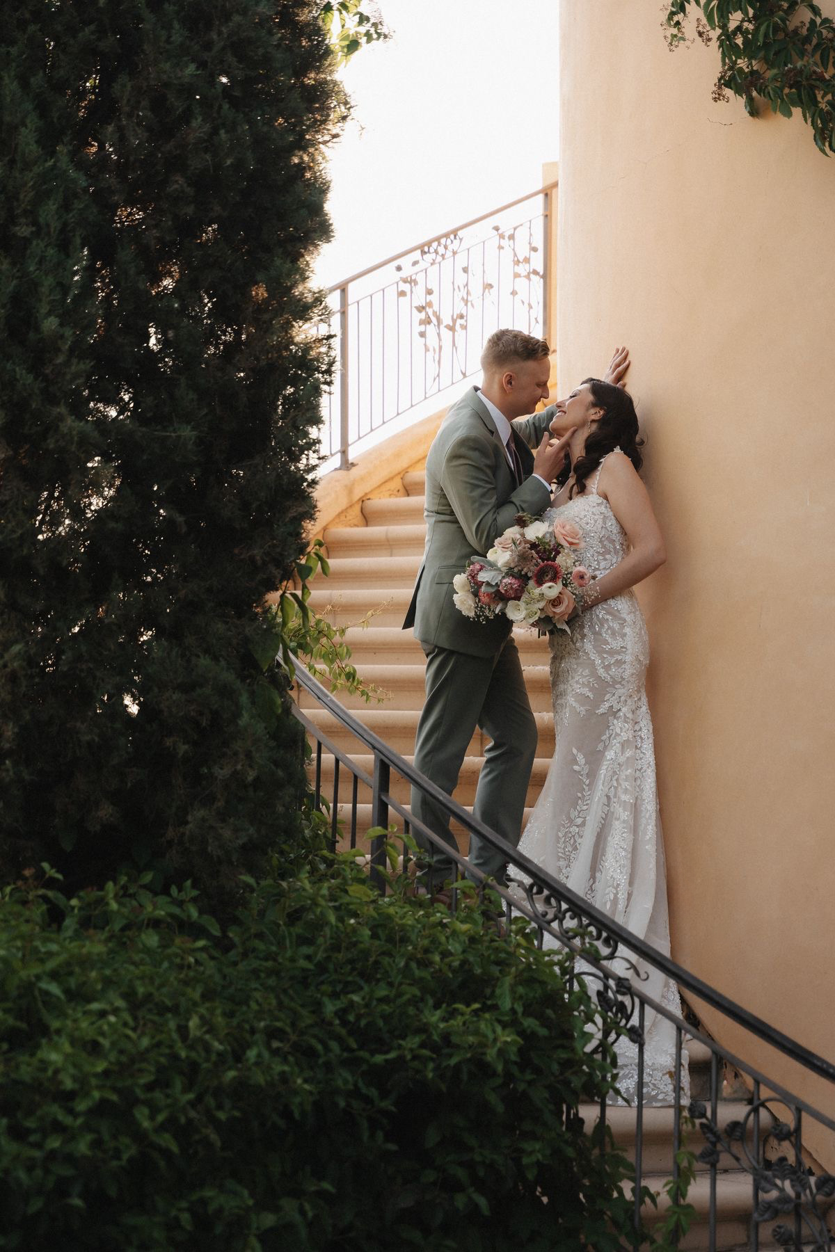 Silhouette of couple kissing at sunset